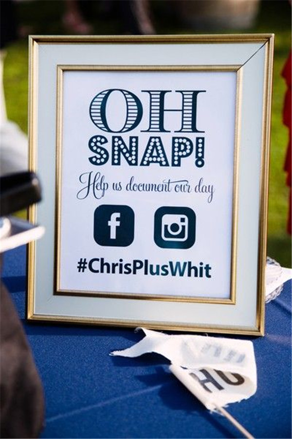 Encourage guests to share their photos with custom wedding hashtag sign